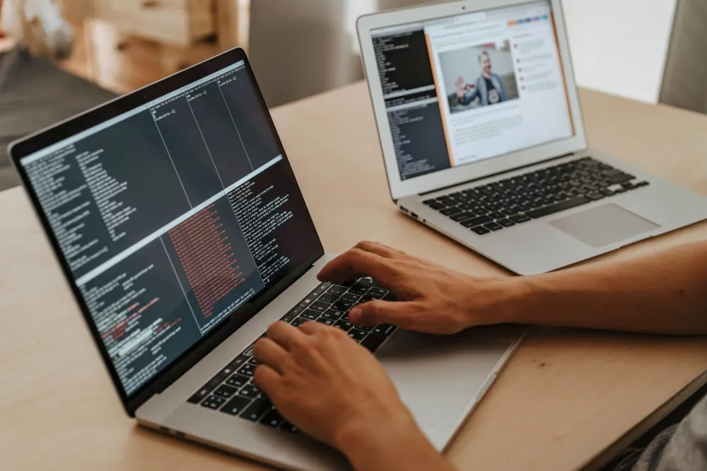 IT support engineer configuring a laptop for a managed IT services client in Dubai