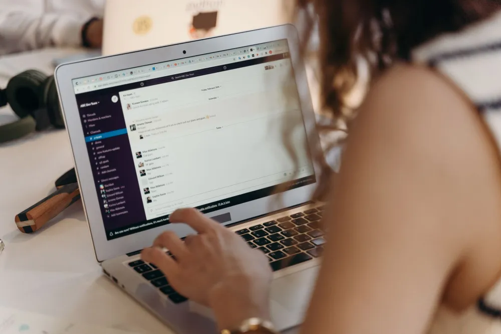 Technician setting up Outlook and Exchange mail on a business laptop in Dubai