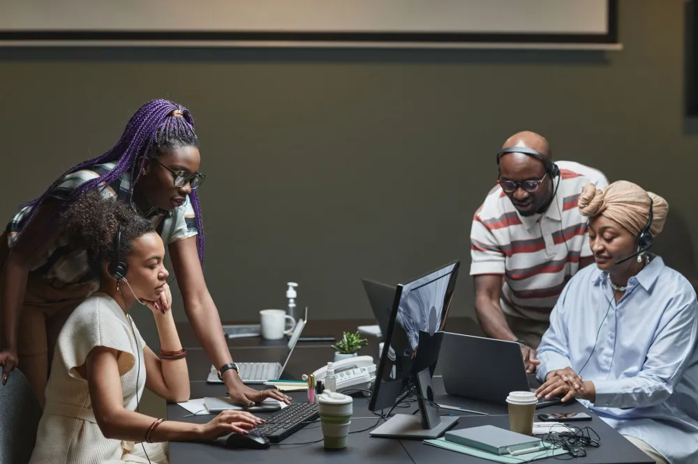 Small business team using Microsoft 365 shared email and calendars in a Dubai office