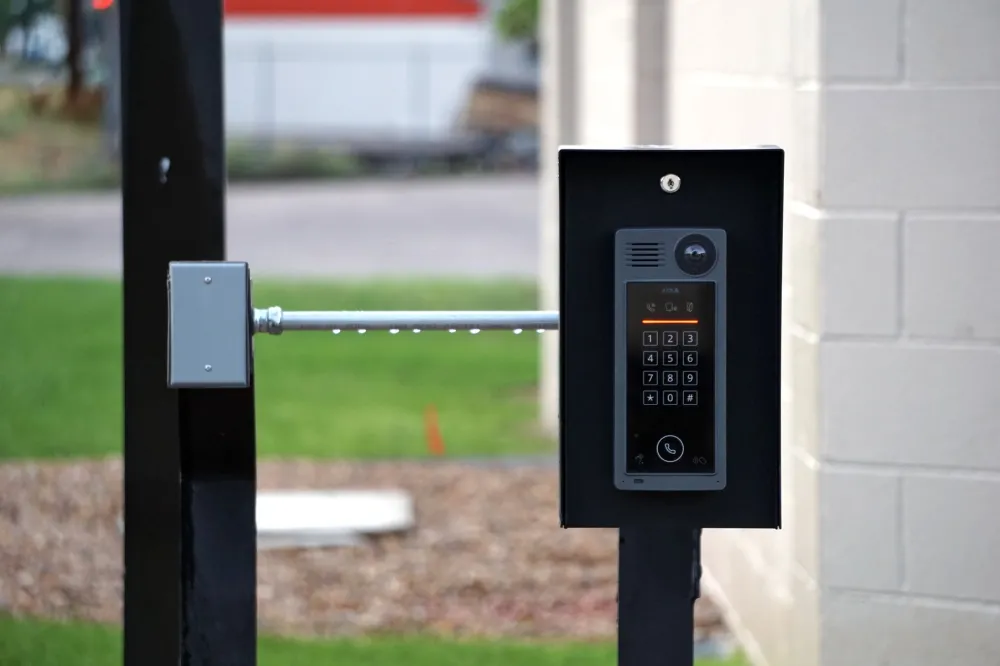 Smart electronic door lock with keypad installed on a glass office door in Dubai