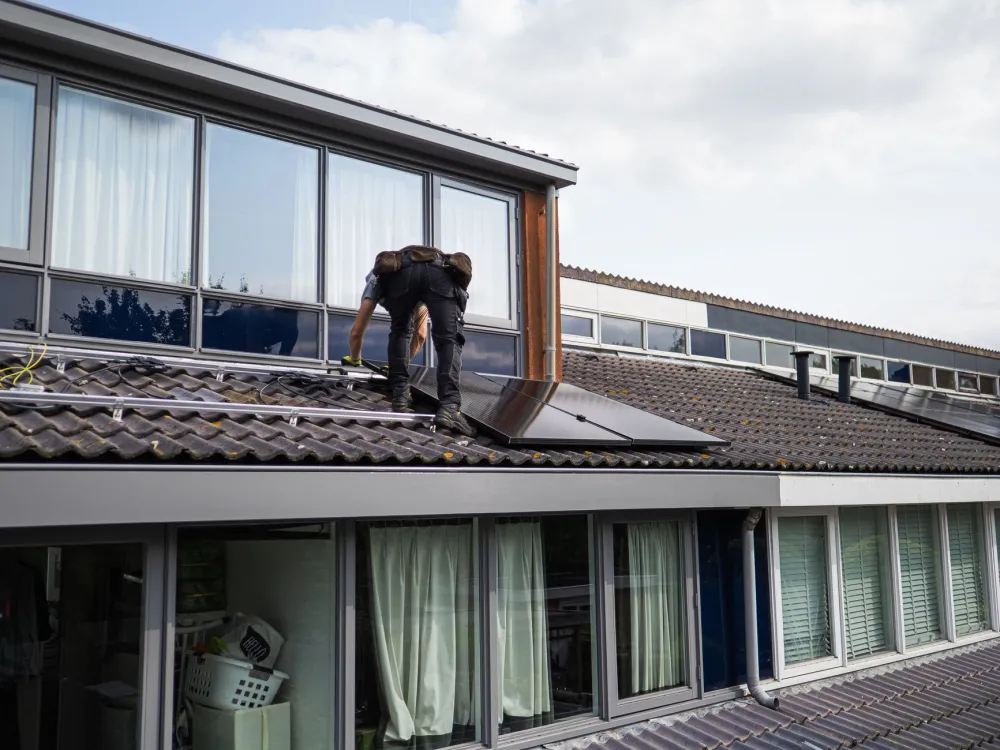 Technician performing Windows 11 installation on a business laptop in Dubai office