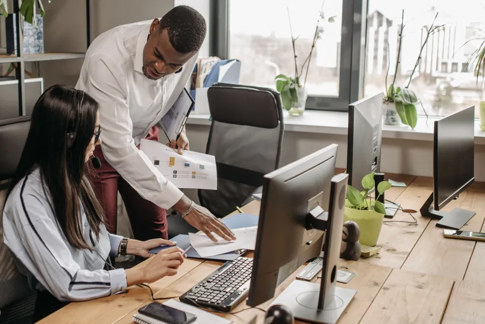 On-site IT support engineer assisting business team with computer services in Dubai