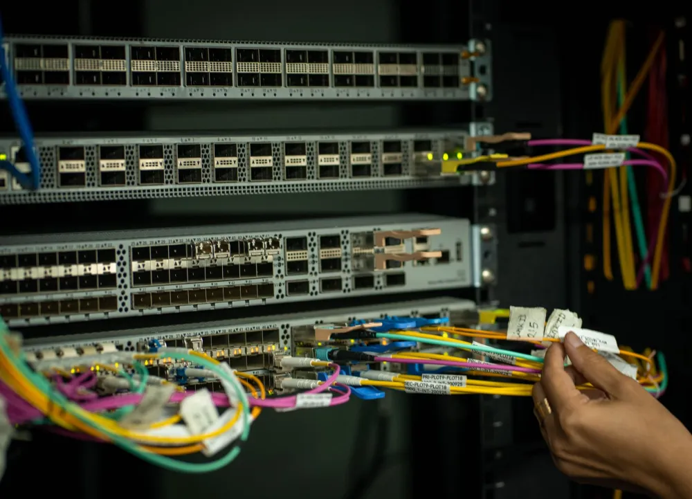 Structured network cabling and managed switch inside a Dubai SME server room