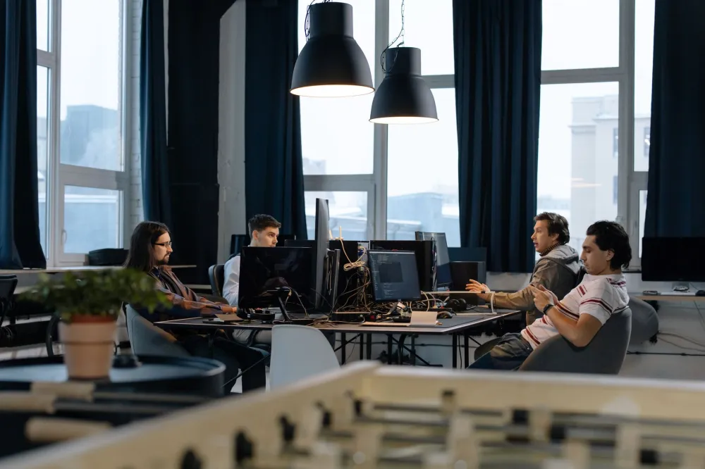 Office team working productively on computers covered by an IT AMC contract in Downtown Dubai