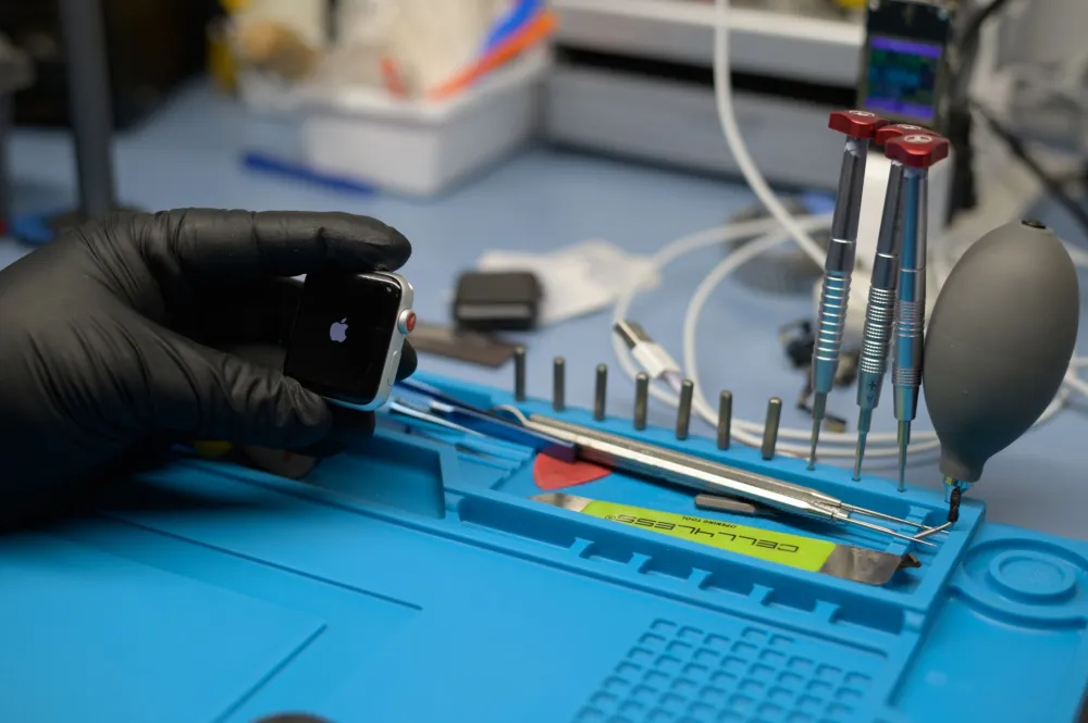 IT technician diagnosing a laptop fault during an emergency business IT support visit