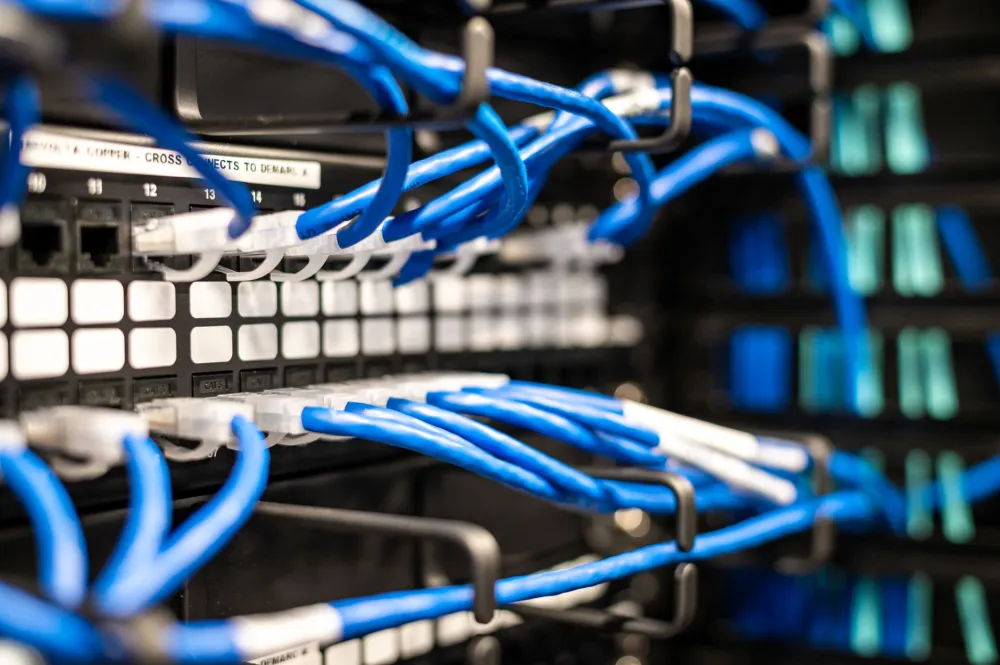 Structured network cabling and switch setup during an IT support job in a Dubai office