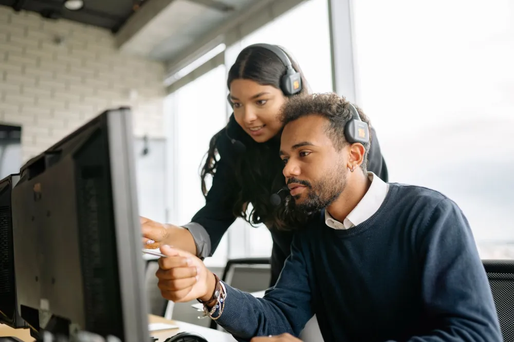 Business team working productively on computers supported by managed IT in Dubai