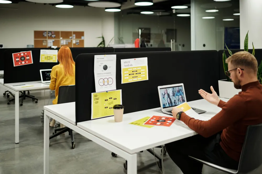 Small business office team using computers supported by managed IT services in Dubai South