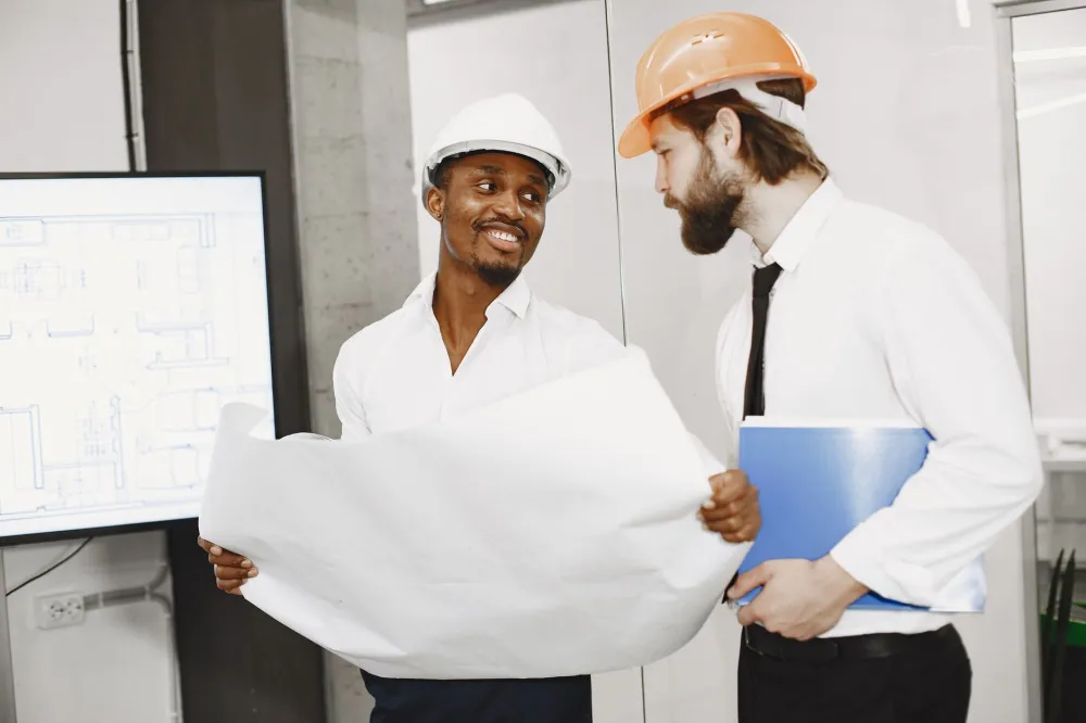 IT technician conducting a site survey for managed IT services at a Dubai South office