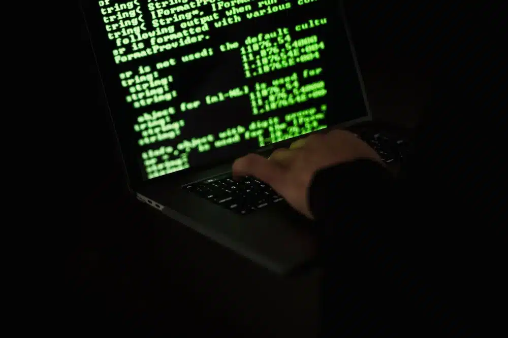 Microsoft Defender security dashboard displayed on a laptop screen in an SME office