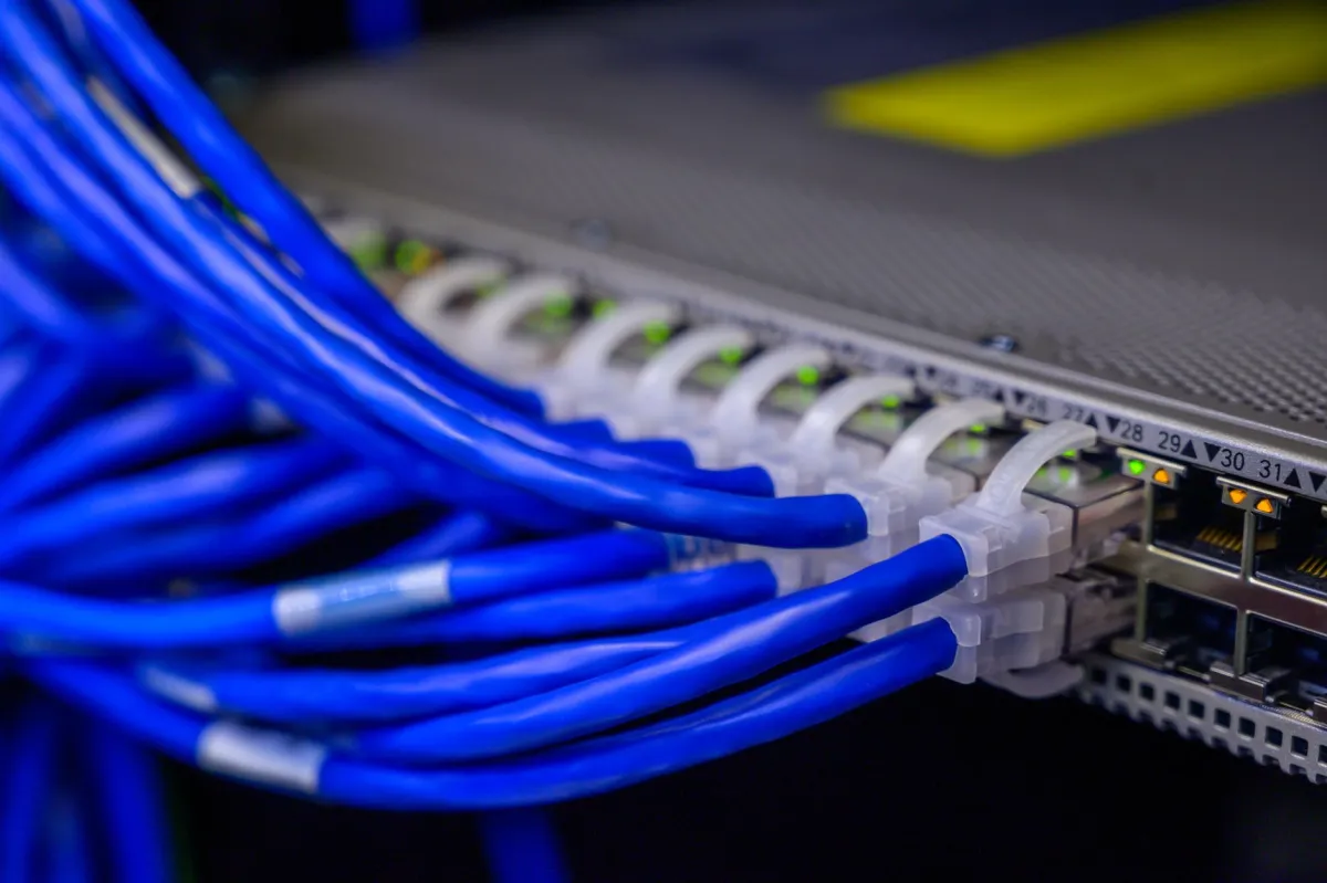 IT engineer performing office network setup in a Dubai Media City office