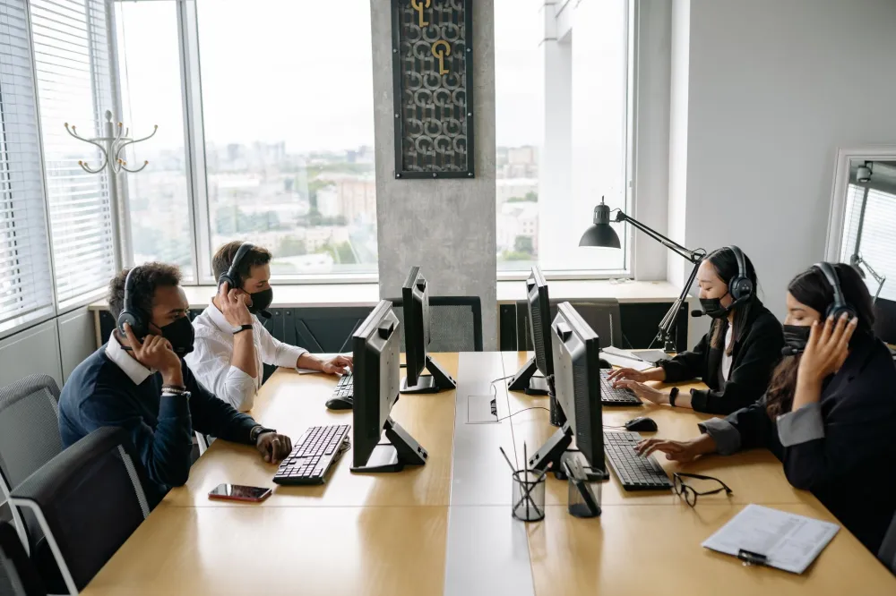 Office team working on computers after a successful network setup in Jebel Ali Dubai