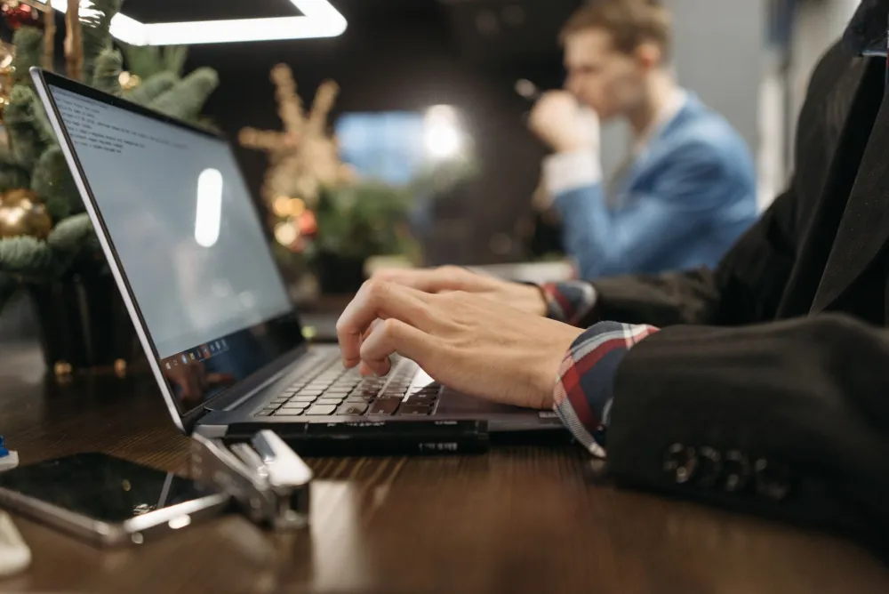 Engineer conducting a software license audit on office computers in Dubai