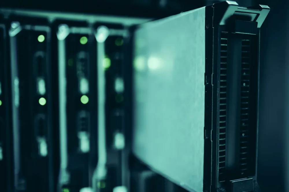 Technician configuring Windows Server hardware in a professional server rack