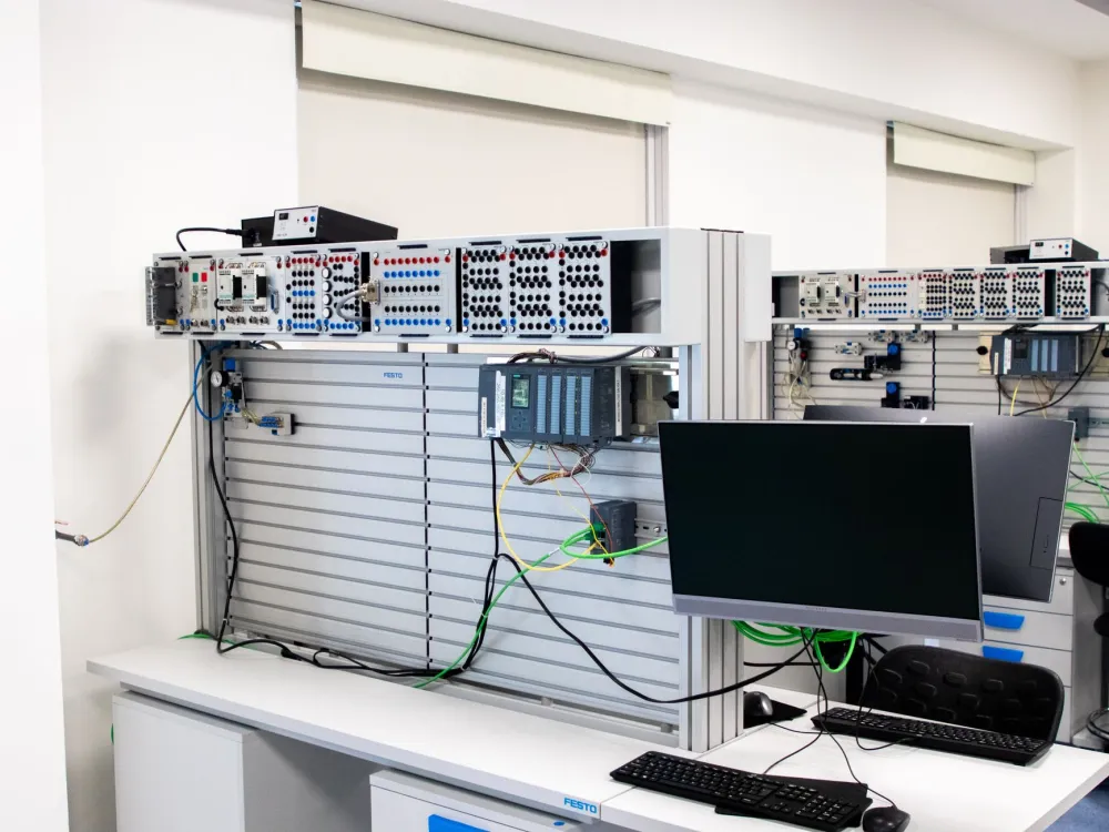 IT engineer configuring a network rack for Fortinet firewall security in Dubai