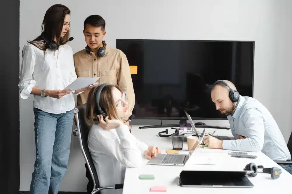 Small business team working on computers protected by a Fortinet firewall in Dubai South