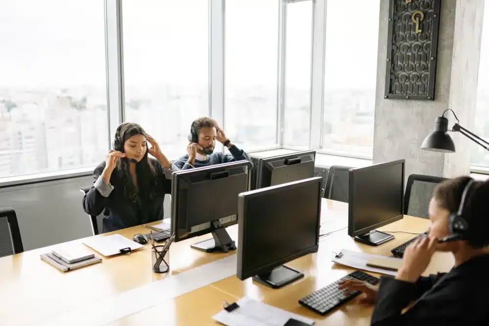 Business team working on computers in a media company office in Dubai