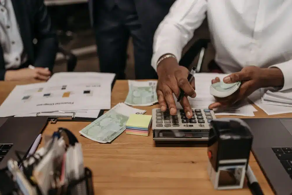 Office manager reviewing IT annual maintenance contract budget plan with IT provider