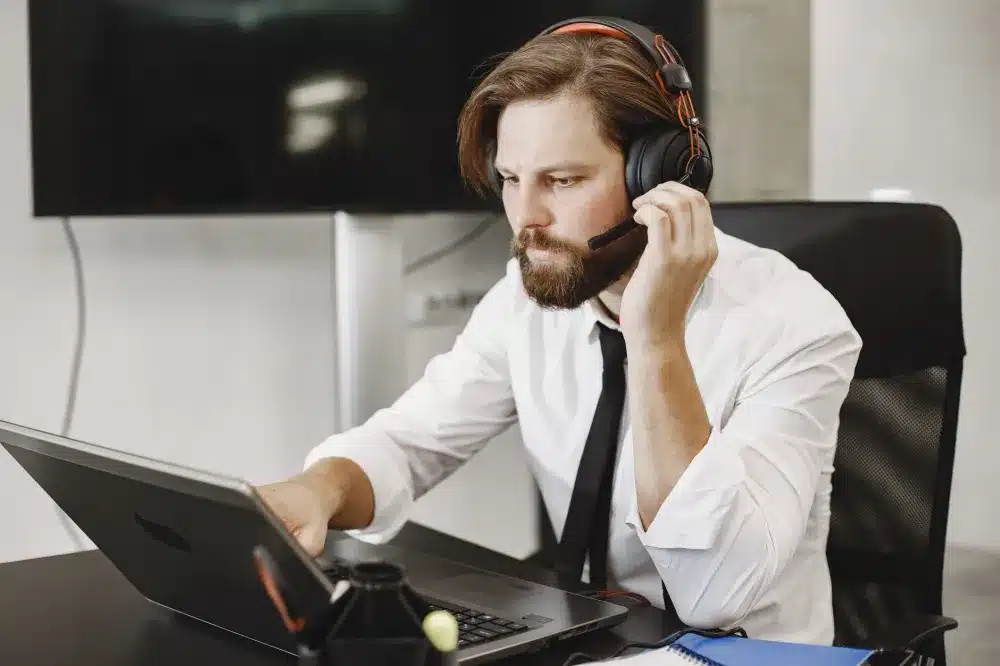 Business owner receiving remote IT support as part of a managed IT services contract in Dubai