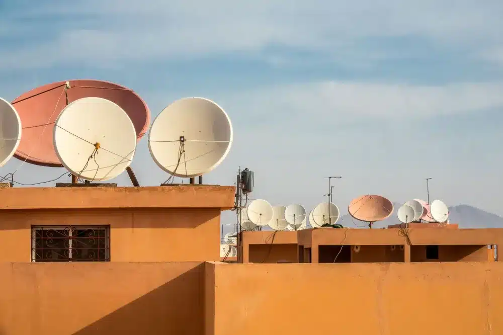 Commercial wireless access point installed on office ceiling for optimised Wi-Fi coverage