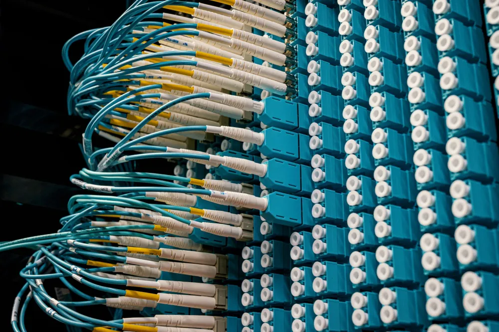 Messy server room in Dubai office showing unmanaged IT infrastructure needing professional support