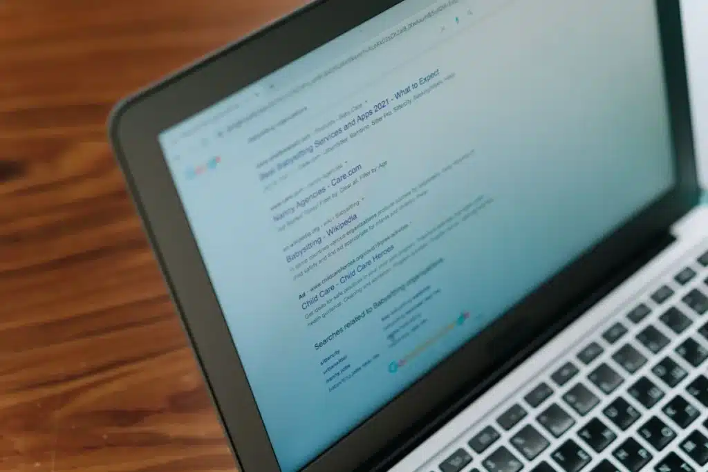 Business owner reviewing signs their website needs a redesign on a laptop screen