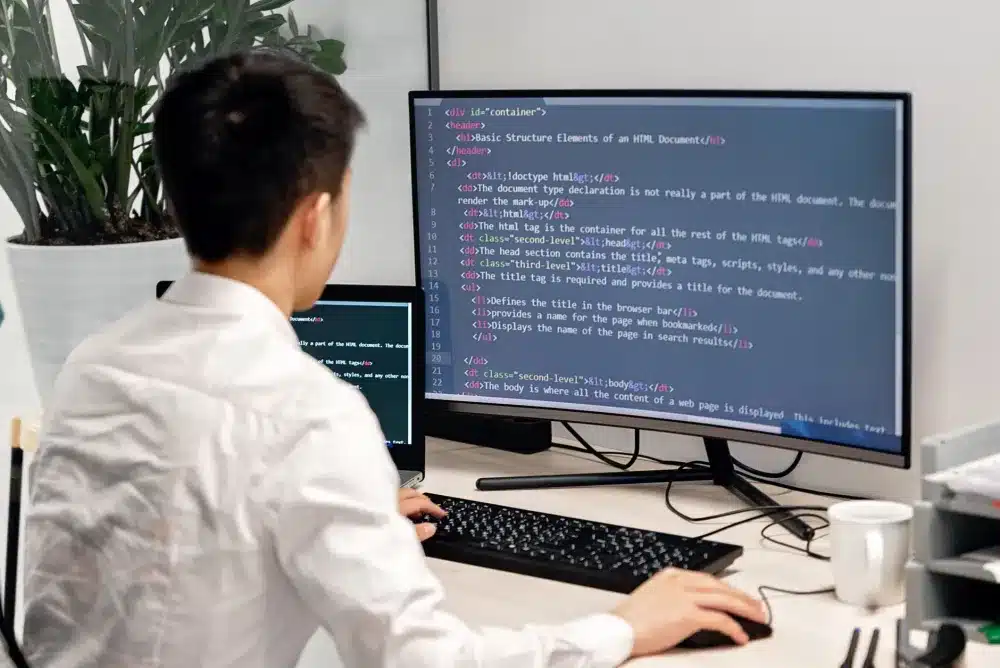 Professional web developer building a new business website in a Dubai office