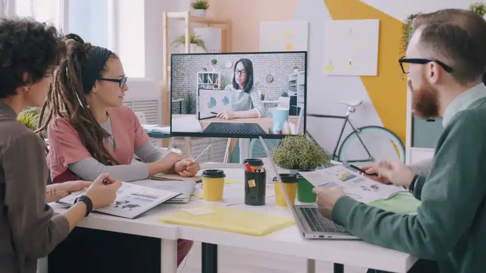Office staff using Remote Desktop Services on laptops in an Oud Metha business