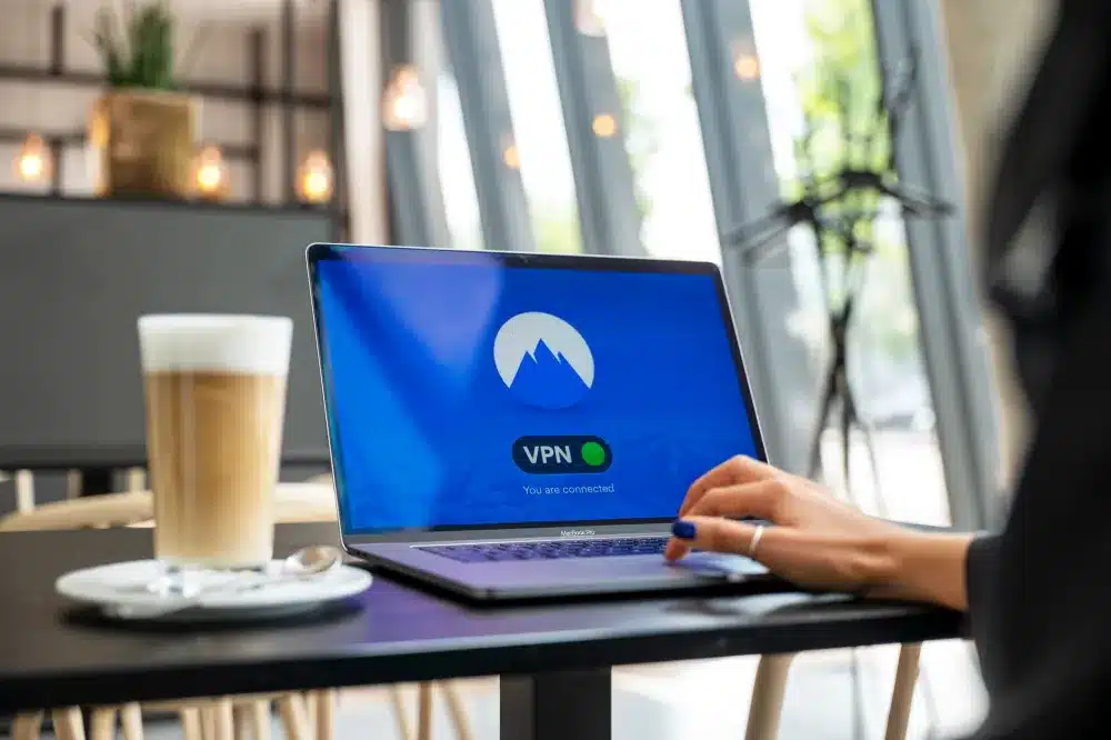 Employee using secure VPN remote access on a laptop for Dubai office network