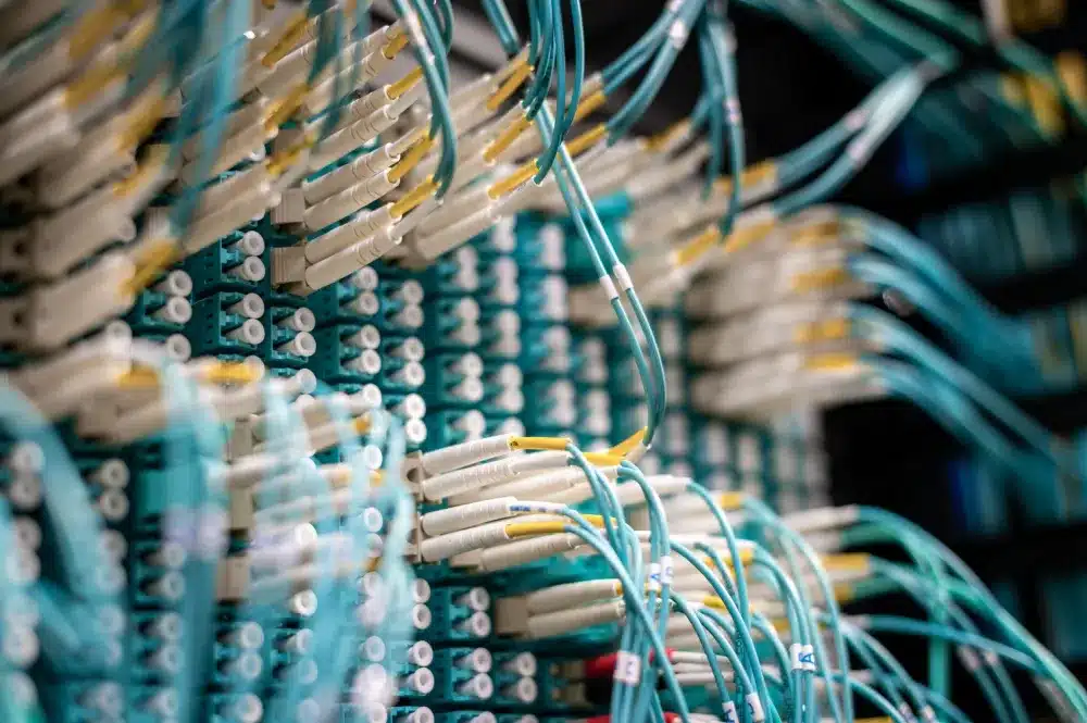 Structured Cat6 network cabling being installed in a new JLT office